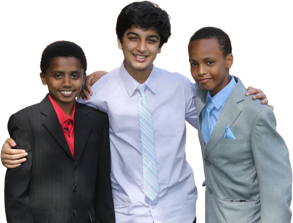 Three youth tutors in shirts and ties, arms around each other's shoulders
